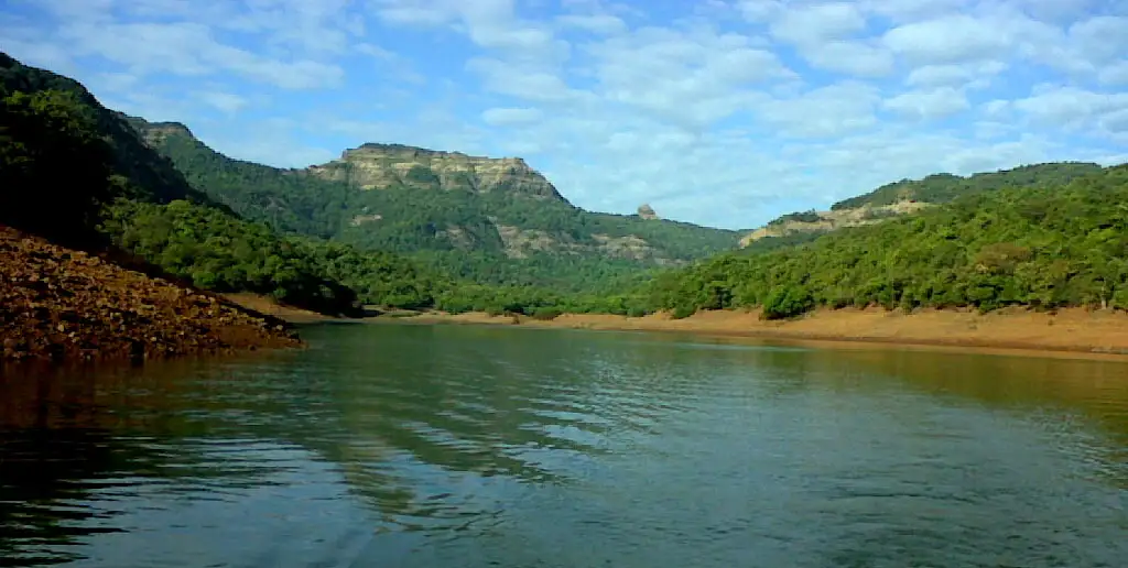 The forested Vasota hill and the Nageshwar pinnacle seen from a boat on the Koyna backwaters