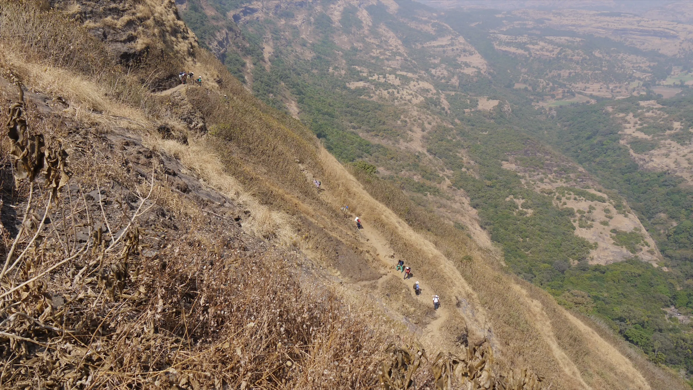 Trekkers on the Tolar Khind trail to Harishchandragad, on the same Balaghat range about 6 km west of Kunjargad; not the Kunjargad trail itself