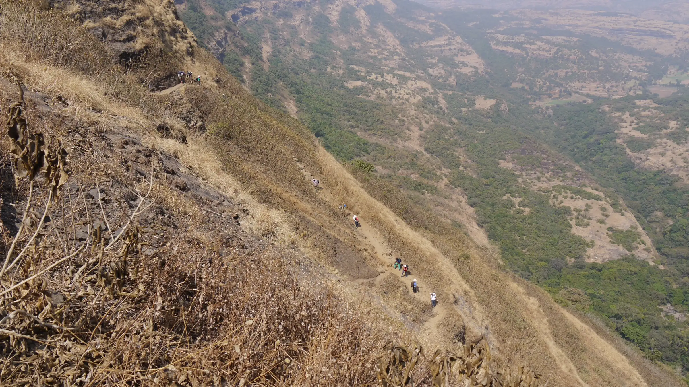 Trekkers on the Tolar Khind trail to Harishchandragad, on the same Balaghat range about 6 km west of Kunjargad; not the Kunjargad trail itself