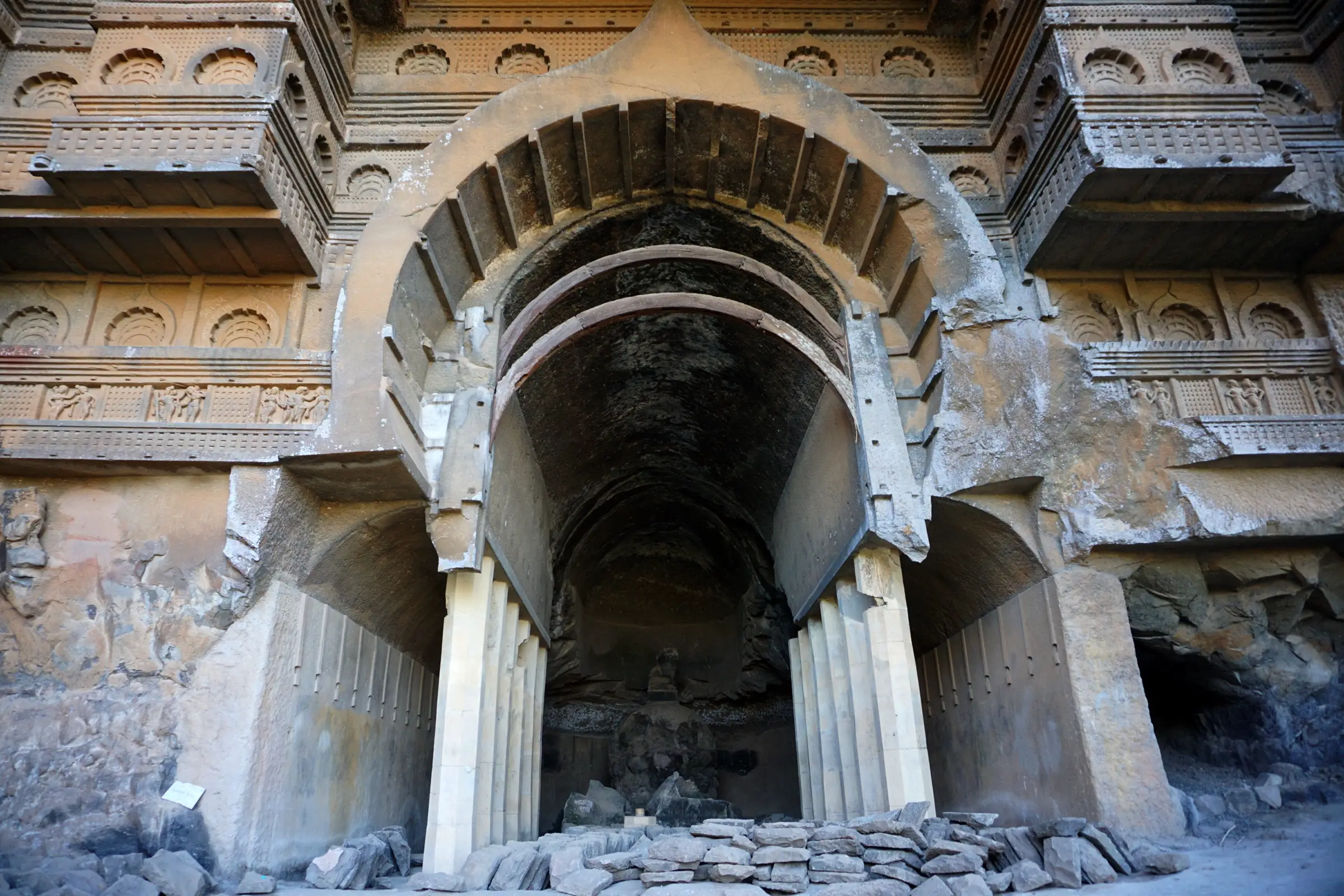 Horseshoe arch and pillars at the entrance of the chaitya hall at Kondana Caves