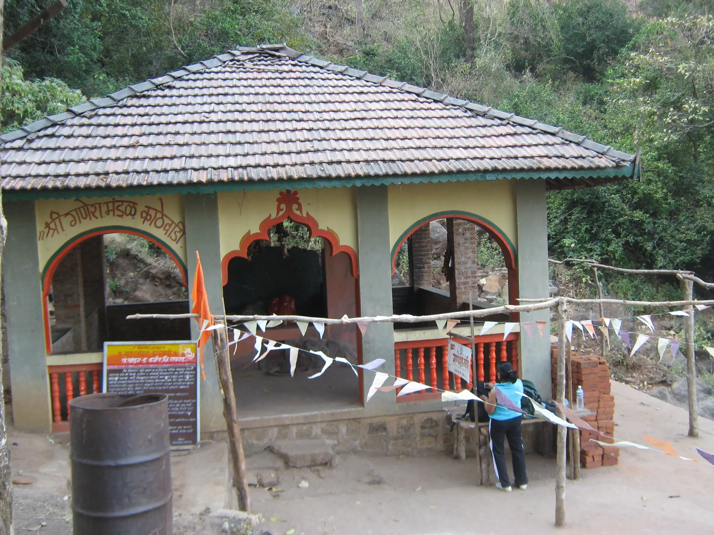 Small Ganesh mandir with a tiled roof at Ganesh Ghat on the Khandas to Bhimashankar trek route