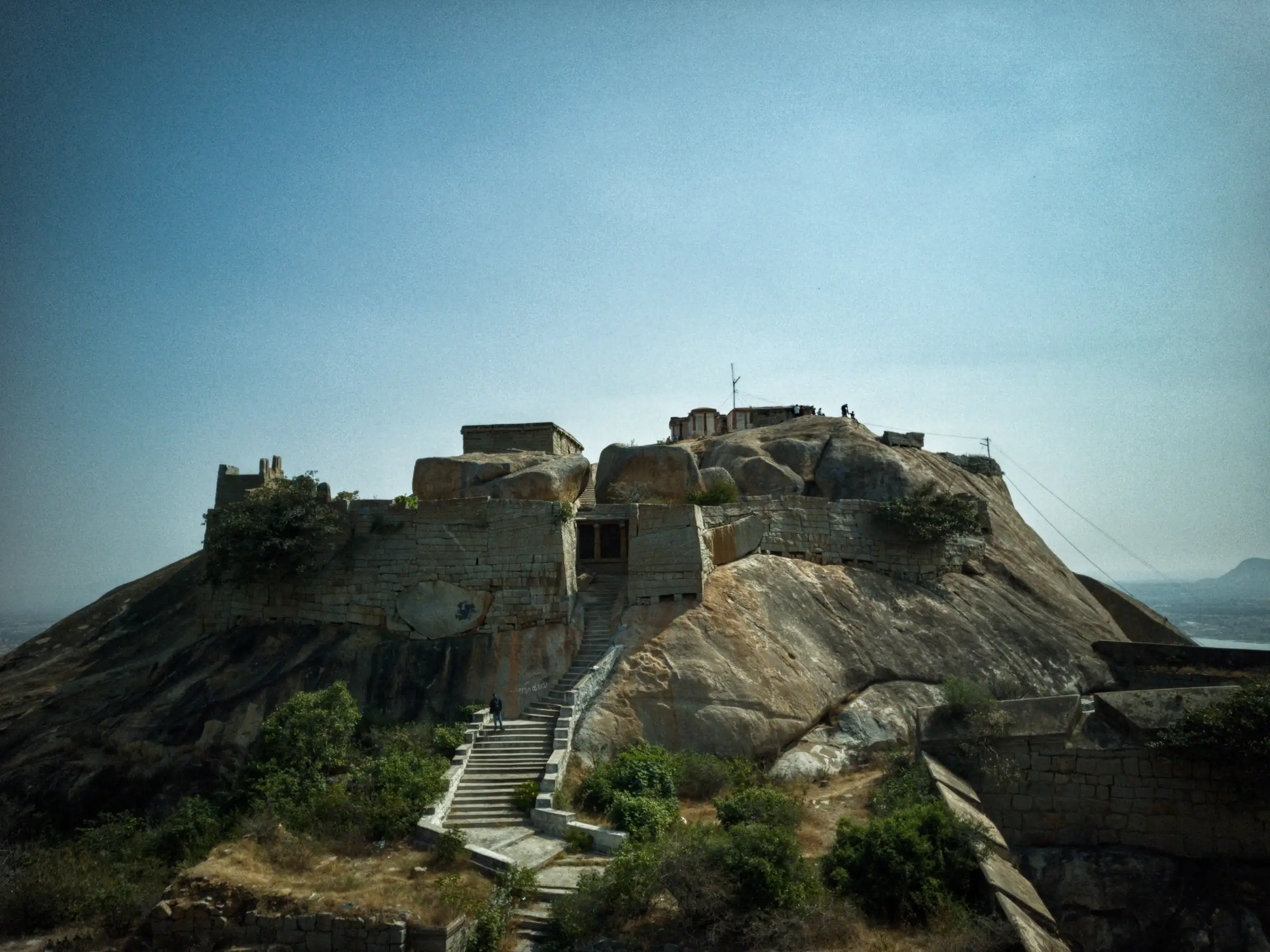 Stone walls and a stairway of Gudibande fort on a granite hilltop, a nearby fort in the same taluk as Varlakonda. It is not Varlakonda Fort itself