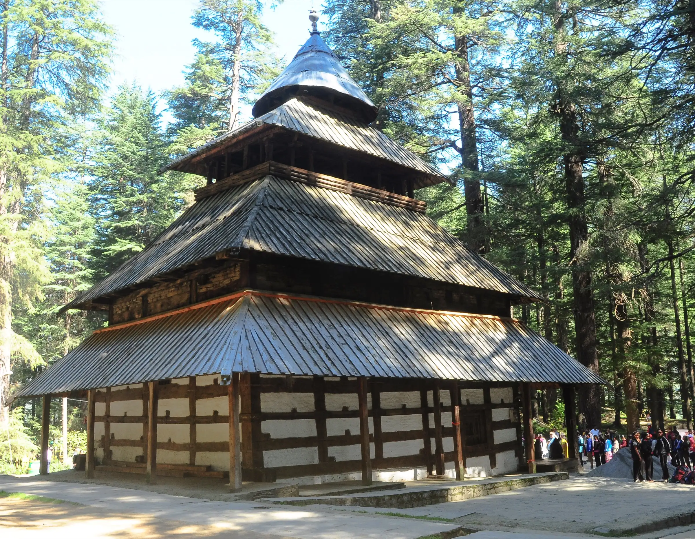 The wooden pagoda-roofed Hadimba Devi Temple among tall deodar trees at Dhungri, Manali, where the trek starts
