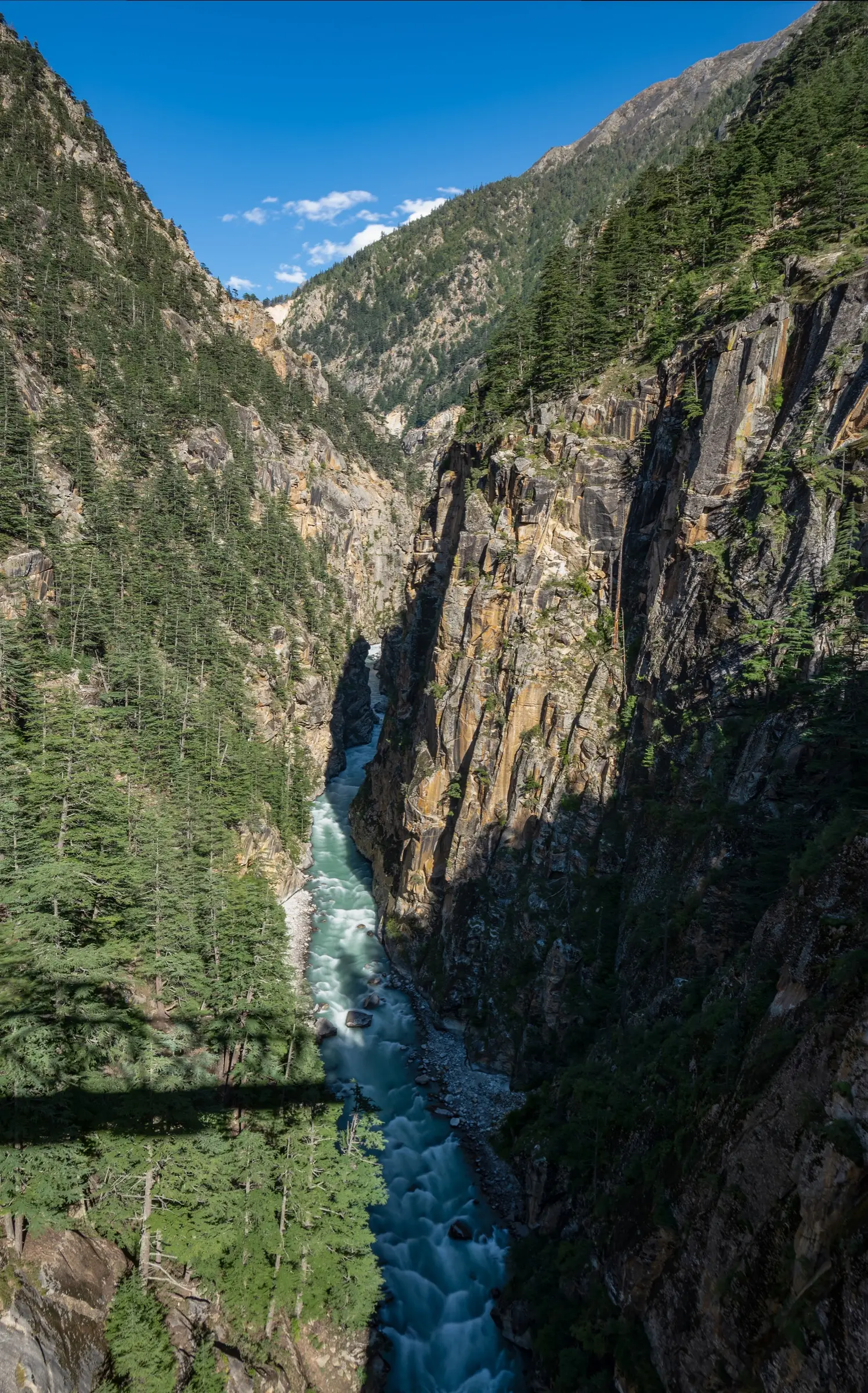 The Jadh Ganga river rushing through a narrow cliff-walled gorge, seen from Lanka Bridge