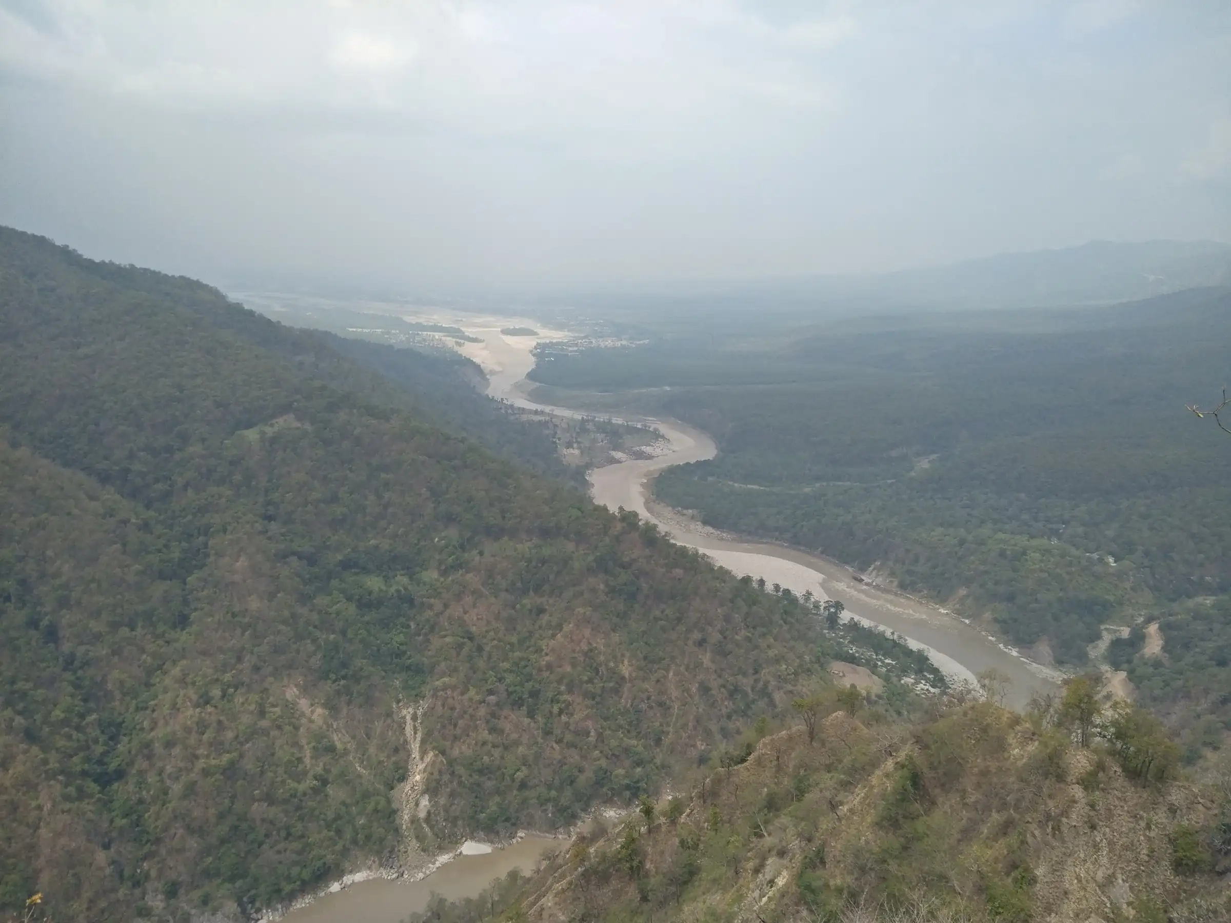 The Sharda (Kali) river winding through forested hills towards the plains, seen from the Annapurna hill at Purnagiri temple
