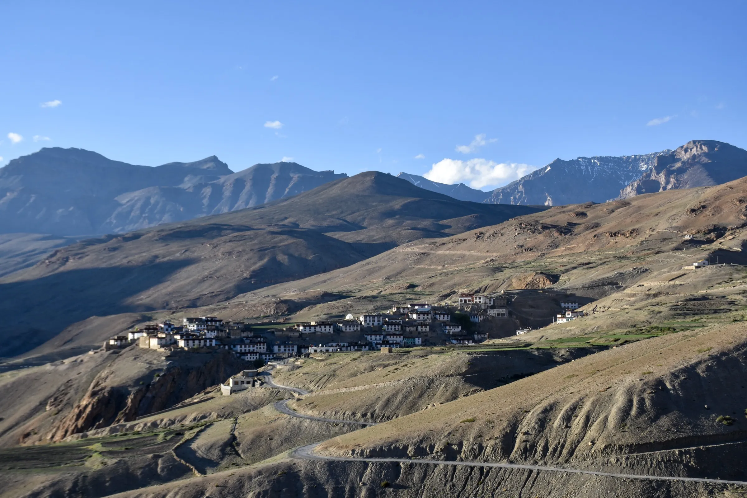 Kibber village on a bare plateau in Spiti with the approach road from Kaza in front, where the Parang La trek begins