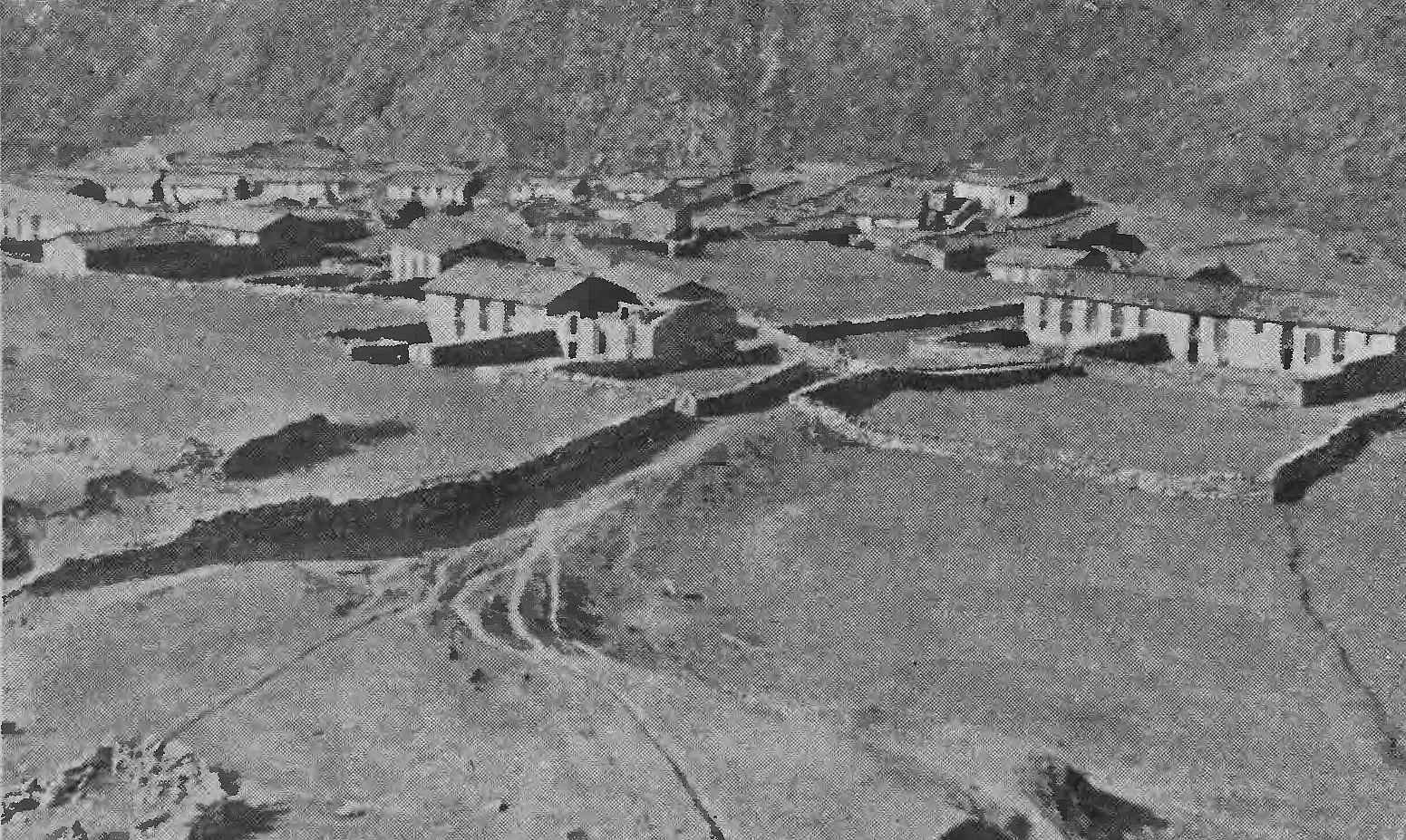 Black-and-white 1939 photograph of the stone houses and walled fields of Martoli village in the Johar valley