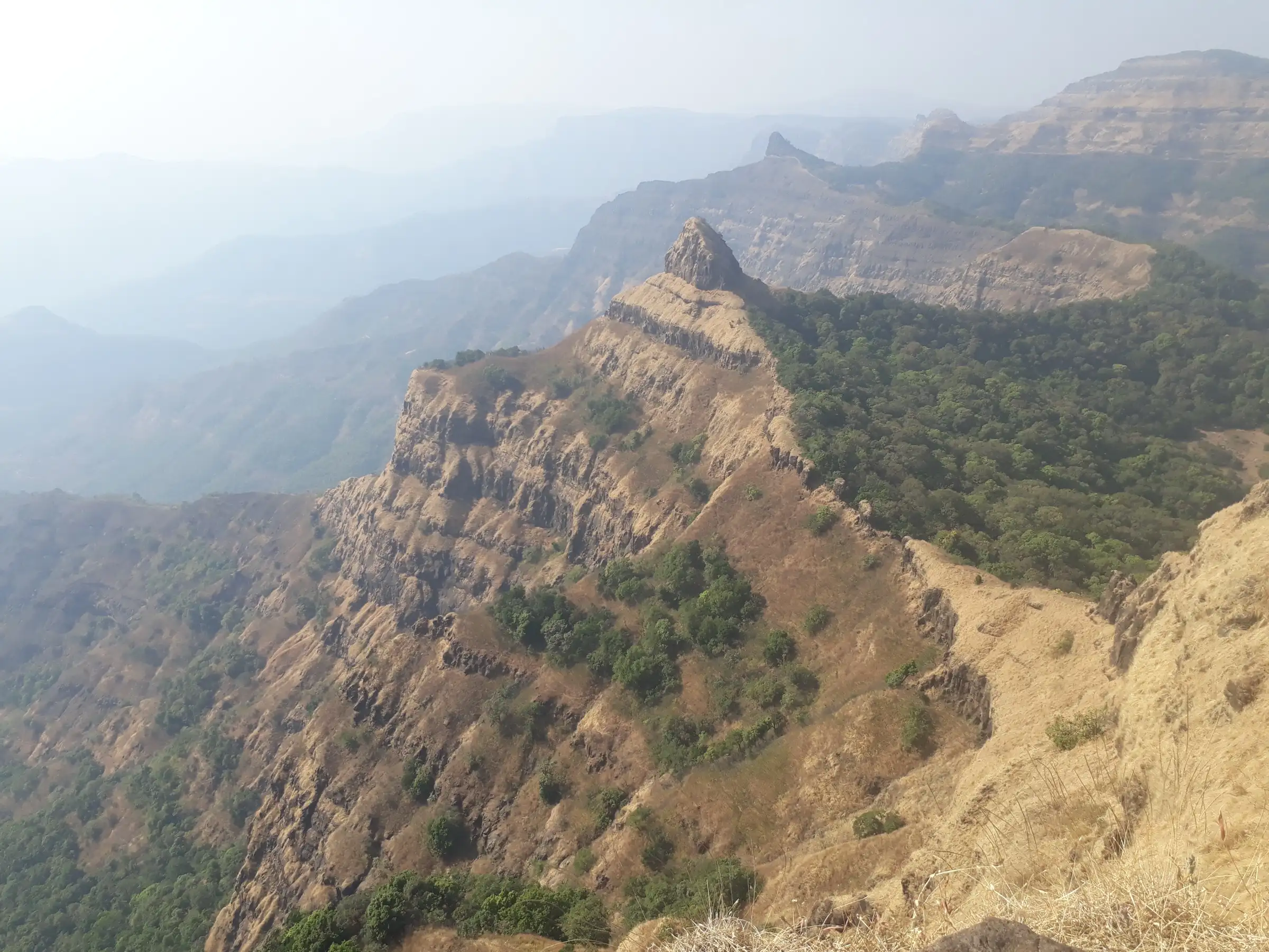 Sahyadri cliffs and the Nageshwar rock pinnacle seen from Vasota Fort