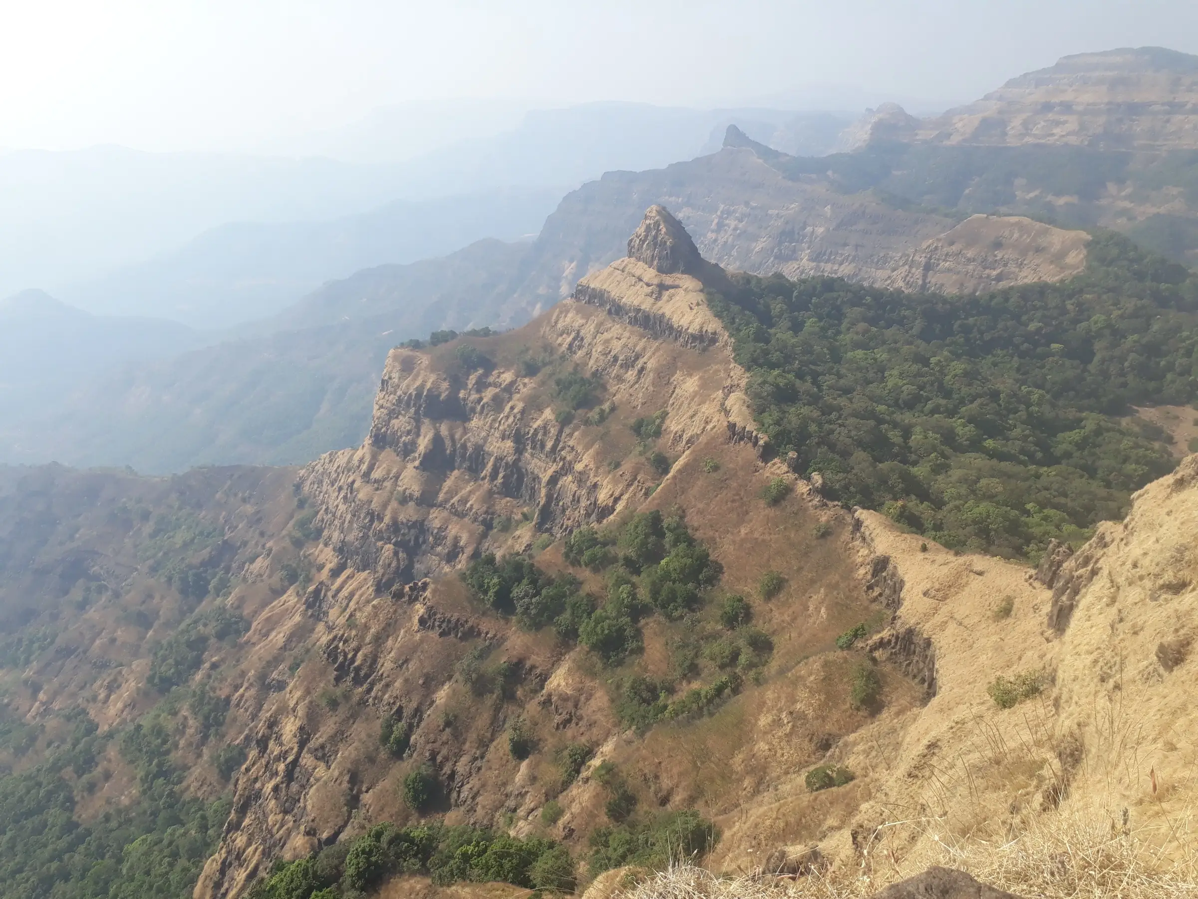 Sahyadri cliffs and the Nageshwar rock pinnacle seen from Vasota Fort