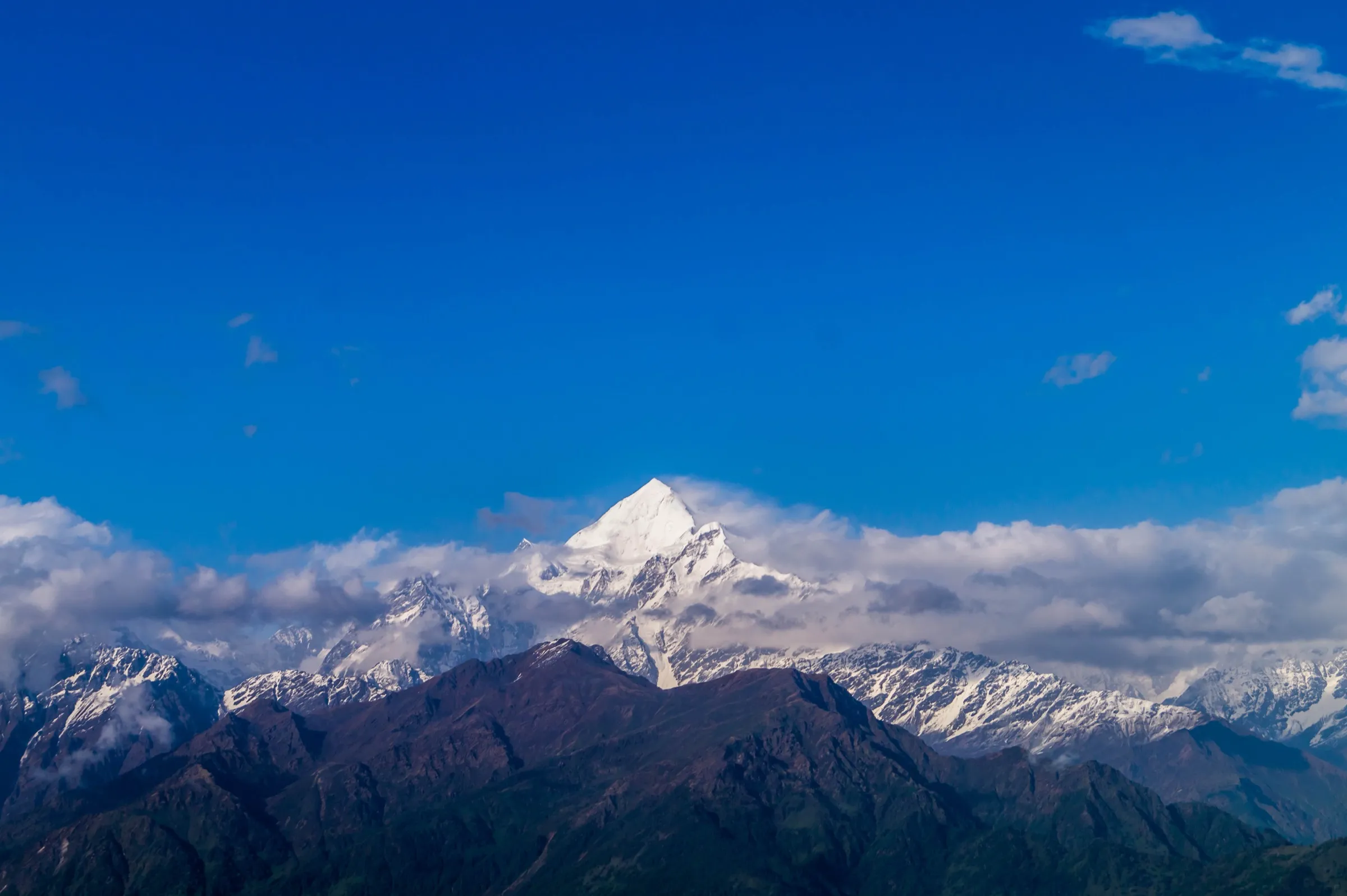 Panchachuli II and its neighbouring snow peaks under a deep blue sky, the main view from the ridges above Munsiyari