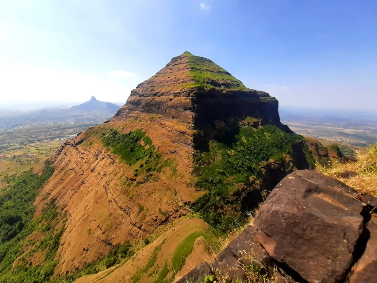 Salher hill, with the Parshuram temple at its summit, seen from the top of Salota fort with green slopes below