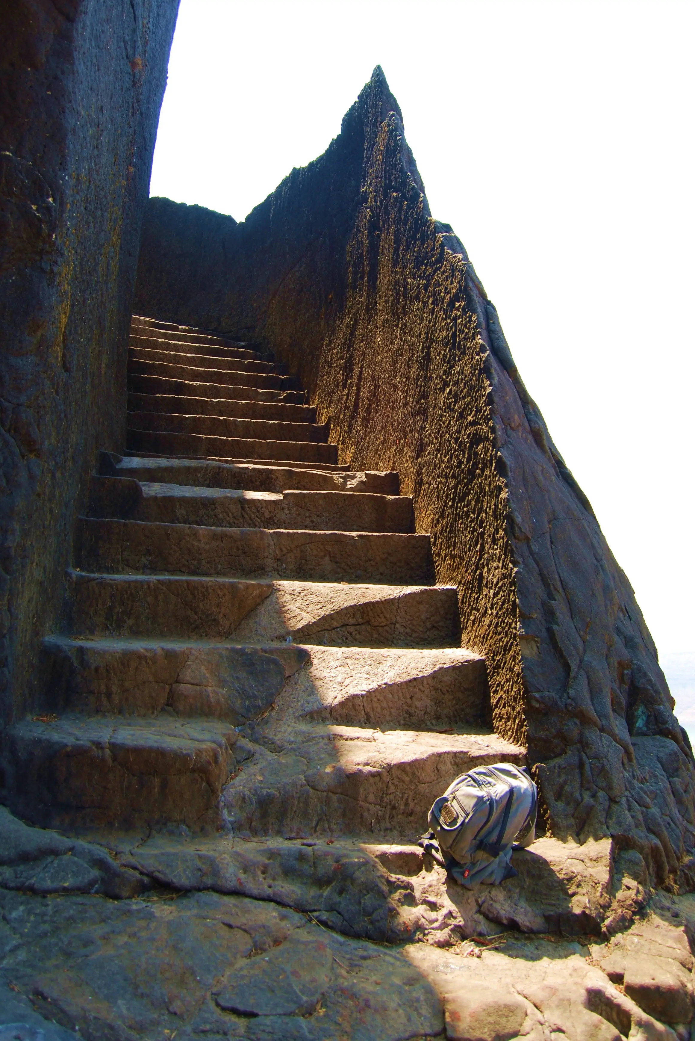 Steep steps cut into a narrow rock gully leading up to Hadsar Fort
