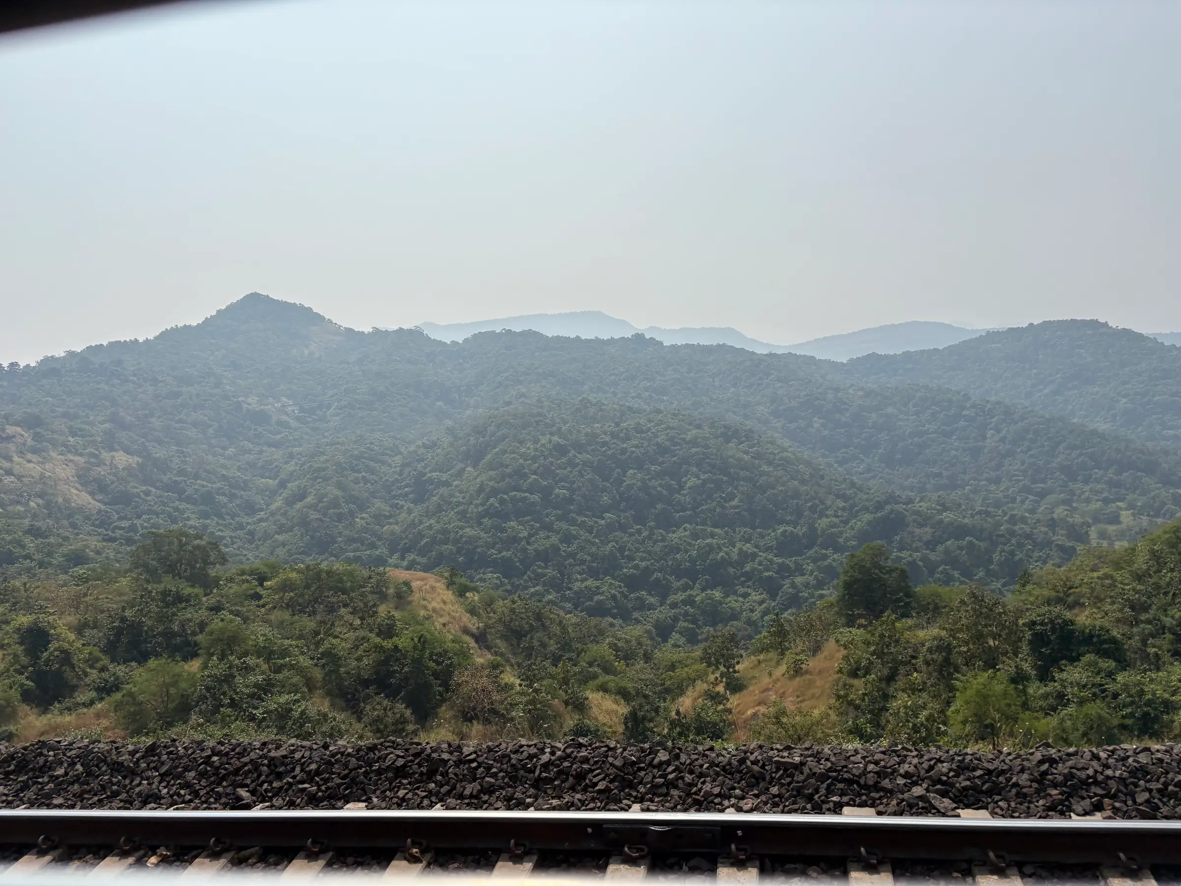Forested hills of the Bor Ghat seen from the railway line near Songiri Fort, near the trek (not a confirmed view of the fort)