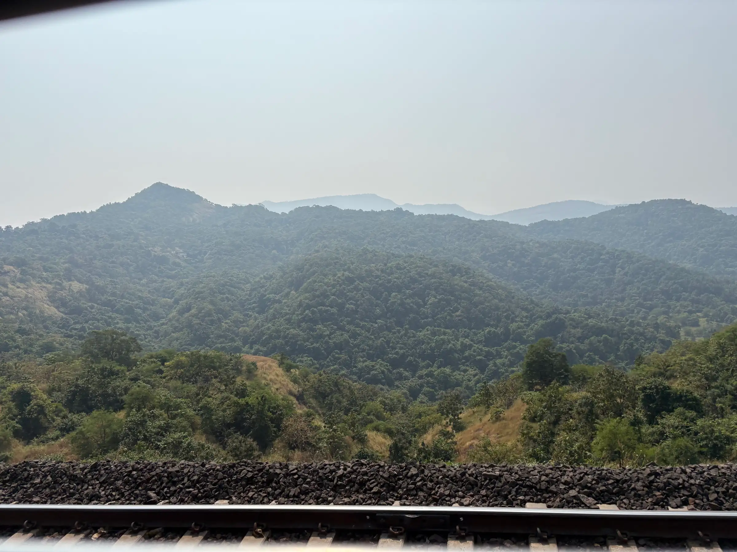 Forested hills of the Bor Ghat seen from the railway line near Songiri Fort, near the trek (not a confirmed view of the fort)