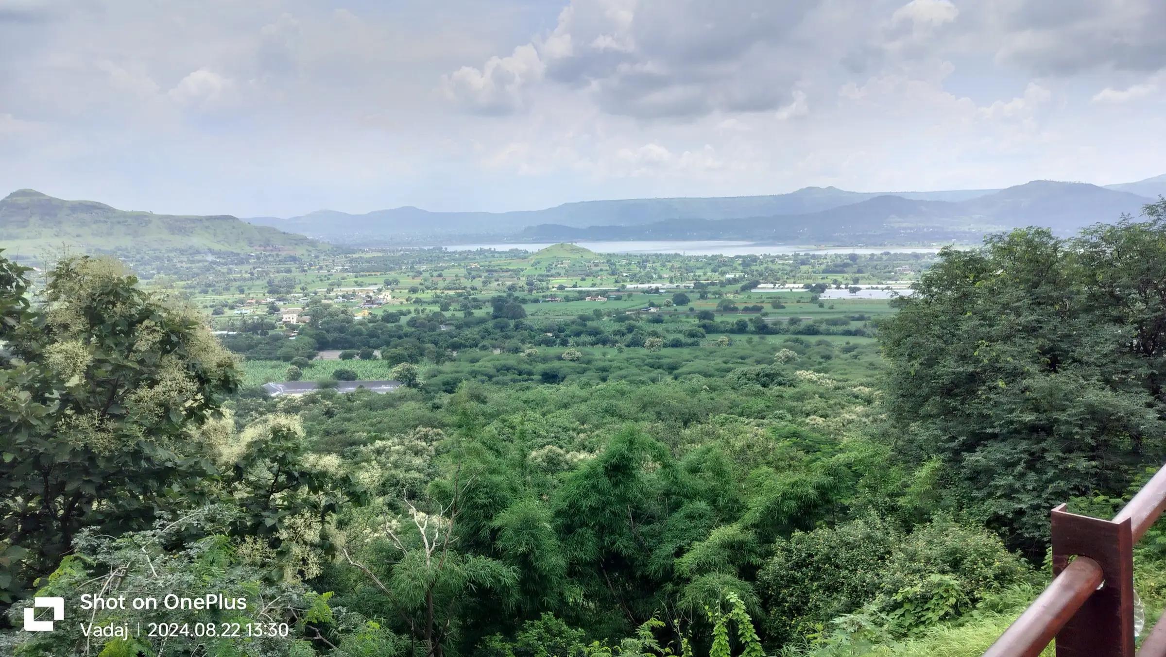 Green fields around Junnar and a reservoir below the Sahyadri hills, seen from the top of Shivneri Fort