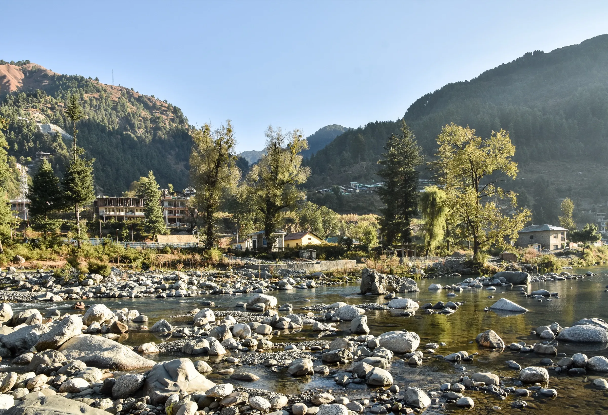 Rocky Uhl River above the reservoir at Barot with forested hills, on the drive to the Lohardi roadhead near the trek (not the pass itself)