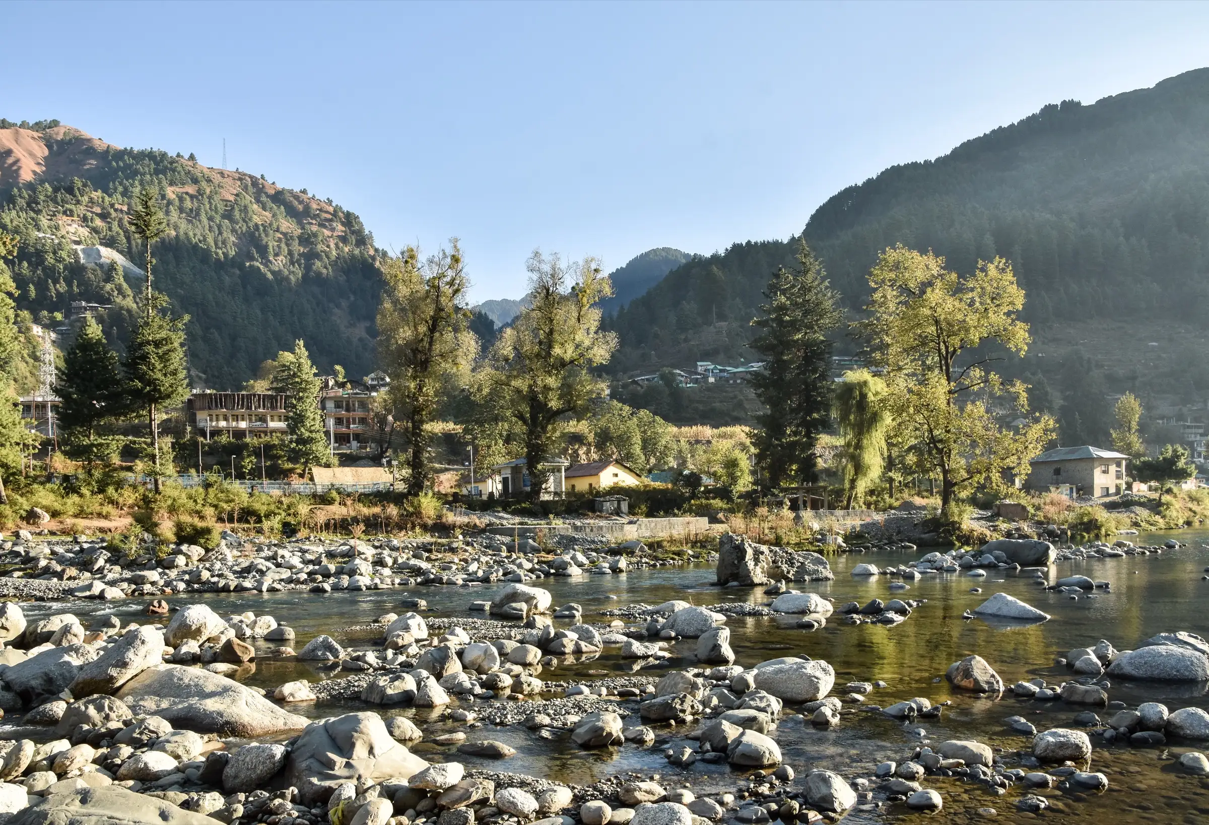 Rocky Uhl River above the reservoir at Barot with forested hills, on the drive to the Lohardi roadhead near the trek (not the pass itself)